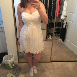 White embroidered dress with stitched flowers